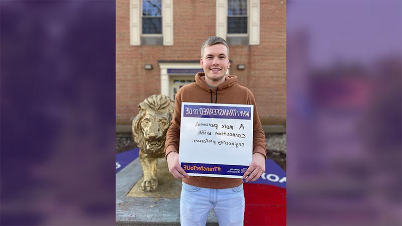 Weston Miller holding sign